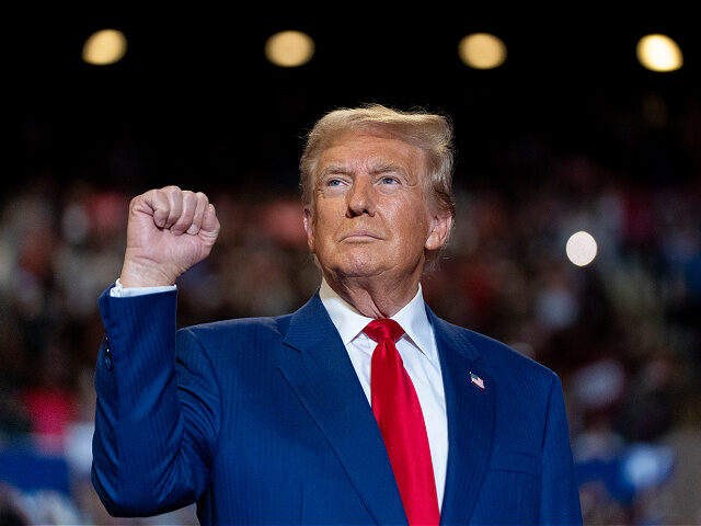 Republican presidential nominee former President Donald Trump pumps his fist as he arrives