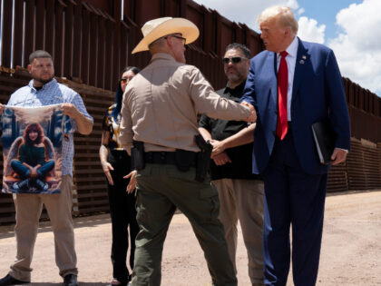 SIERRA VISTA, ARIZONA - AUGUST 22: Cochise County Sheriff Mark Dannels shakes hands with U