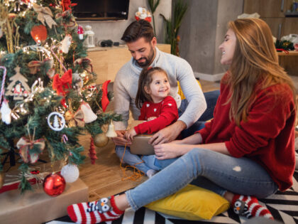 Family at Christmas tree