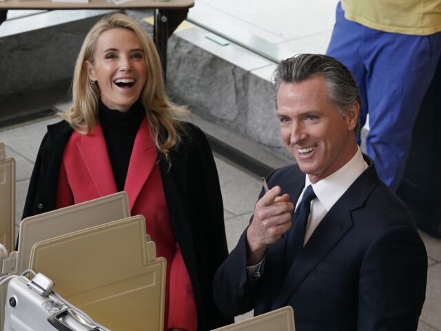 California Gov. Gavin Newsom and his wife, first partner Jennifer Siebel Newsom laugh as t