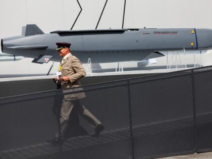 An attendee walks past a Storm Shadow/Scalp missile, developed by MBDA Inc., on day two of