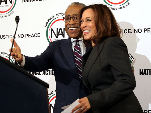 The Rev. Al Sharpton (L) welcomes Sen. Kamala Harris (D-CA) to the podium before she addre