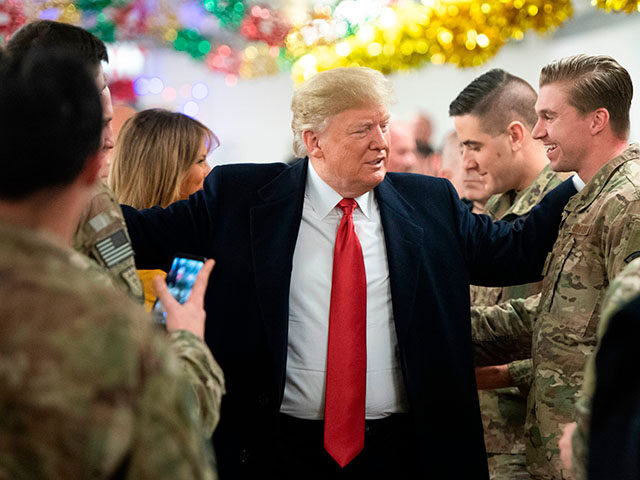 US President Donald Trump and First Lady Melania Trump greet members of the US military du