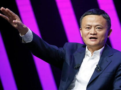 Chairman of Alibaba Group Holding Ltd. Jack Ma delivers a speech to participants during th