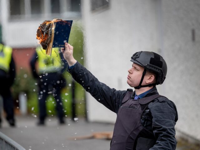 STOCKHOLM, SWEDEN - MAY 14: Rasmus Paludan burns a Koran during an election meeting in Hus