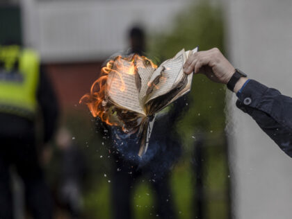 STOCKHOLM, SWEDEN - MAY 14: Rasmus Paludan burns a Koran during an election meeting in Hus