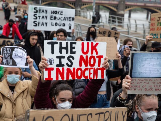 NEWPORT, WALES - JUNE 11: Black Lives Matter supporters carry placards as they march from