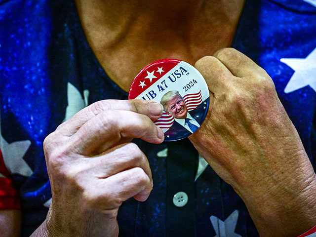 Supporters of former US President Donald Trump wait to see the president speak at a campai