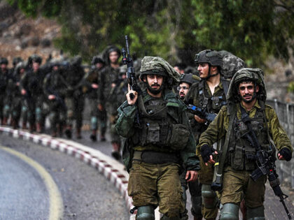 Israeli army soldiers patrol an undisclosed area in northern Israel bordering Lebanon on O