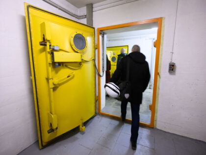 25 January 2024, Lower Saxony, Hanover: Visitors enter a former air raid shelter under the