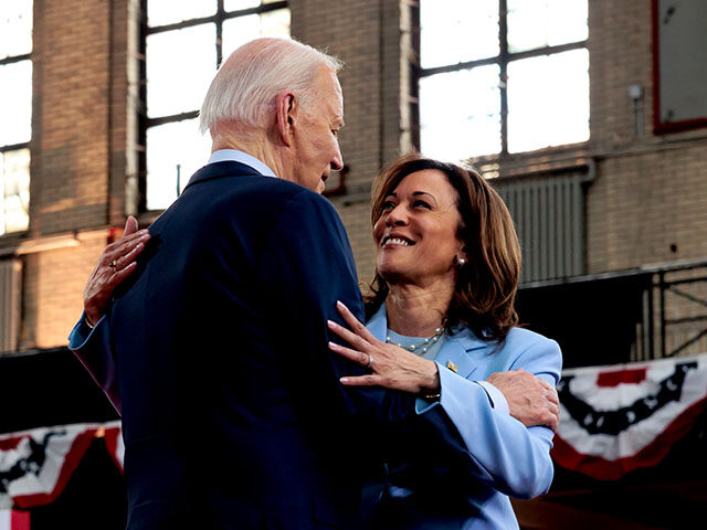 US President Joe Biden, left, embraces Vice President Kamala Harris during a campaign even