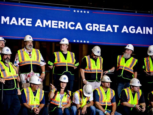 Workers on stage prior to a campaign event with former US President Donald Trump, not pict