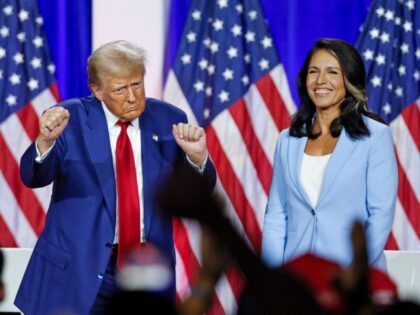 Former US President and Republican presidential candidate Donald Trump (L) dances as he le