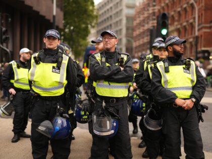 Police officers at a Pro-UK rally endorsed by Tommy Robinson, as supporters march from Vic