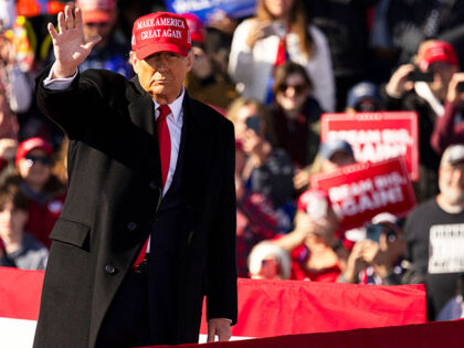 Former US President Republican presidential candidate Donald Trump waves to the crowd as h