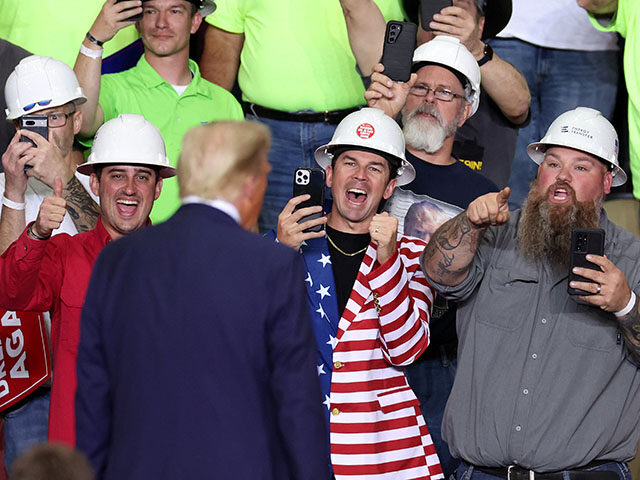 Former US President and Republican presidential candidate Donald Trump gestures at support