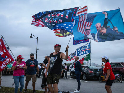 Supporters of former US President and Republican presidential candidate Donald Trump show