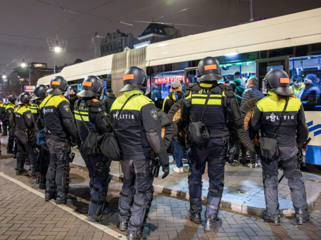 Dutch mobile Police officers stand guard after several scuffles broke out in the city cent