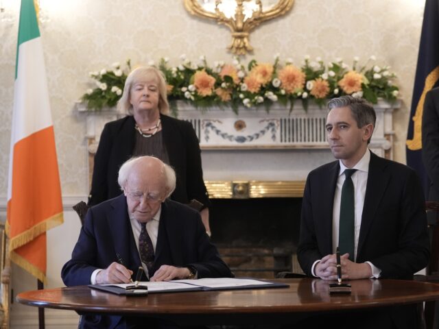 President Michael D Higgins and Taoiseach Simon Harris during the signing of the Warrant o