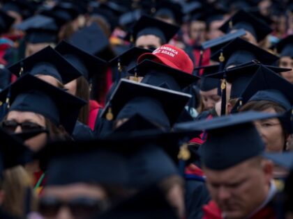 Students wait to hear US President Donald Trump speak during Liberty University's commence