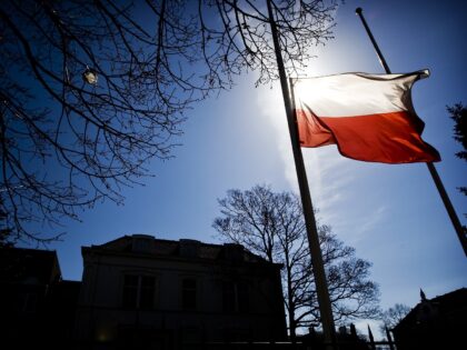 The national flag of Poland flies at half mast in front of the Polish Embassy in The Hague