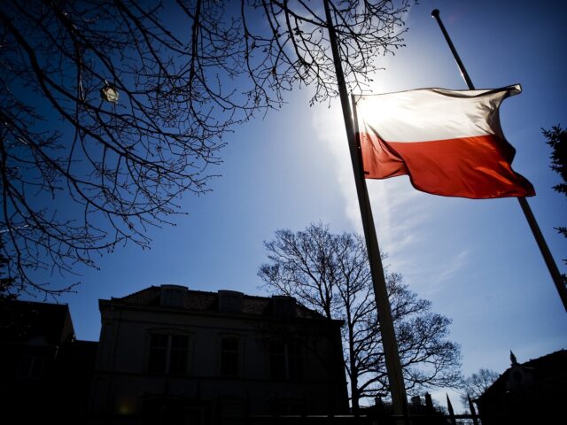 The national flag of Poland flies at half mast in front of the Polish Embassy in The Hague