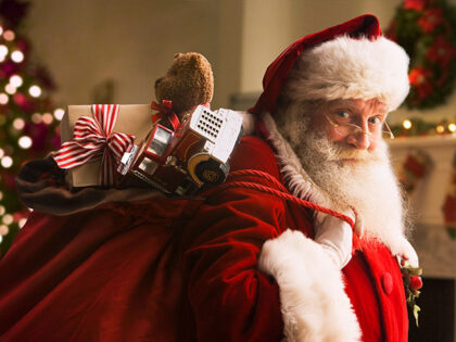 Santa Claus carrying sack of gifts