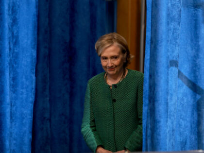 Happy Thanksgiving! Former Secretary of State Hillary Clinton arrives to speak during a g