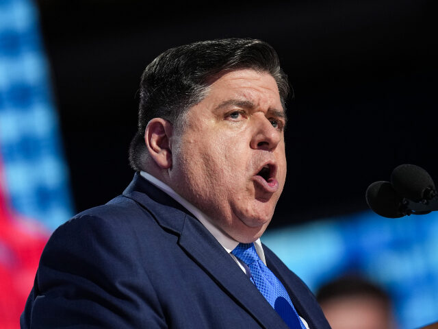 Illinois Gov. J.B. Pritzker speaks on stage during the second day of the Democratic Nation