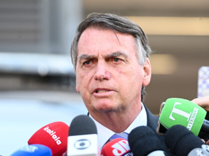 Jair Bolsonaro, Brazil's former president, speaks to members of the media after depar