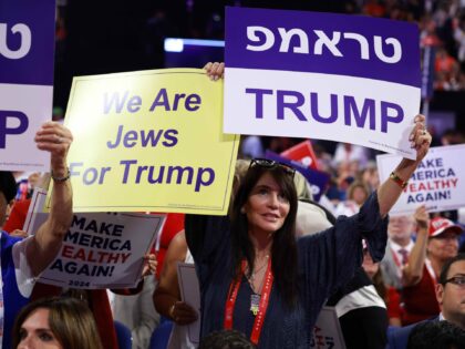 MILWAUKEE, WISCONSIN - JULY 15: A person holds a "We Are Jews For Trump" sign on