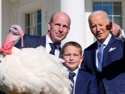 President Joe Biden, right, stands with John Zimmerman, left, chair of the National Turkey