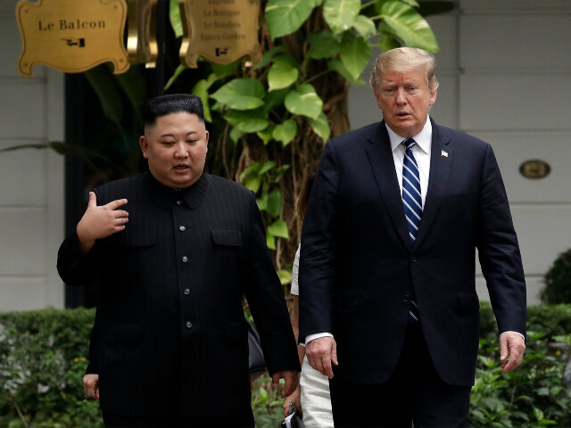 President Donald Trump and North Korean leader Kim Jong Un take a walk after their first m