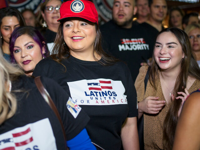 Jen Salinas, Vice President of Latinos 4 Trump, takes photos with the groups supporters af