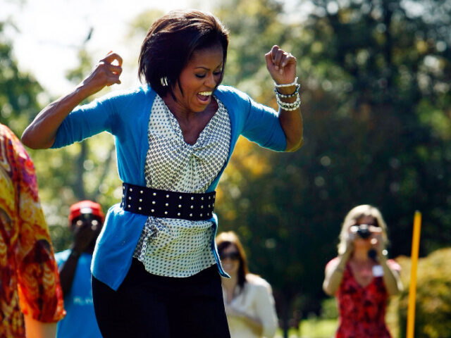 U.S. first lady Michelle Obama reacts as she jump ropes "Double Dutch" on the So