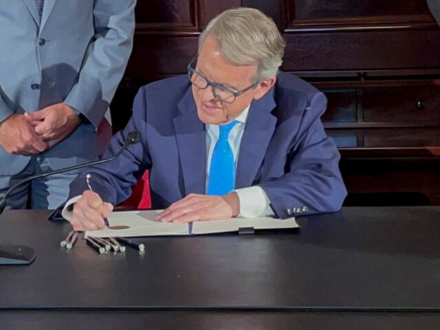 Ohio Governor Mike DeWine signs an executive order allowing college athletes in Ohio to ea