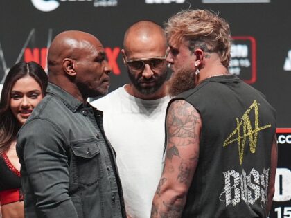 Mike Tyson, front left, and Jake Paul, front right, face off during a news conference ahea