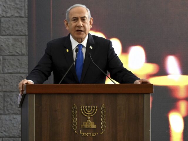 Israeli Prime Minister Benjamin Netanyahu speaks at a memorial ceremony for those killed b