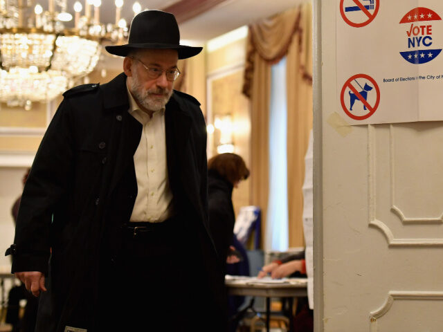 A voter of the Jewish community is seen leaving after he cast his ballot in the midterm el