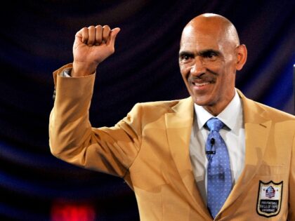 CANTON, OH - AUGUST 4, 2016: 2016 Hall of Fame enshrinee, coach Tony Dungy pumps his fist