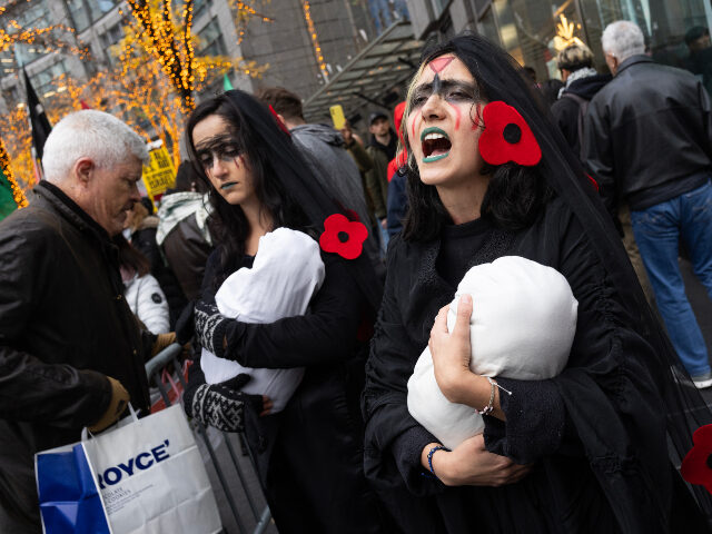 NEW YORK, NEW YORK - NOVEMBER 29: Pro Palestinian demonstrators march through midtown Manh