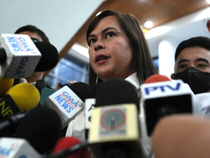 Philippine Vice President Sara Duterte talks to reporters while a hearing she is attending