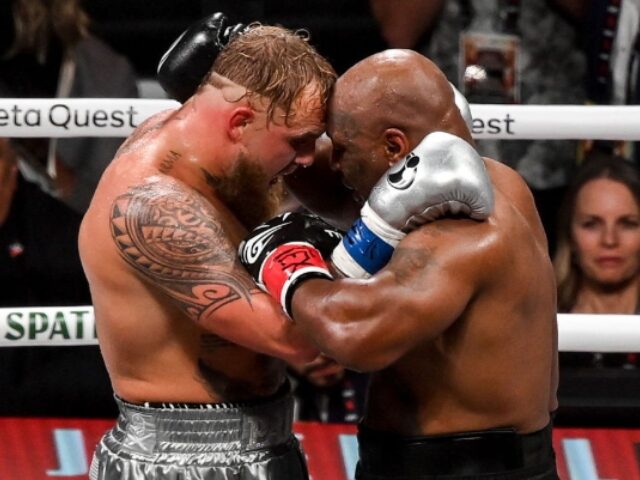 Texas , United States - 15 November 2024; Jake Paul, left, and Mike Tyson hug after their