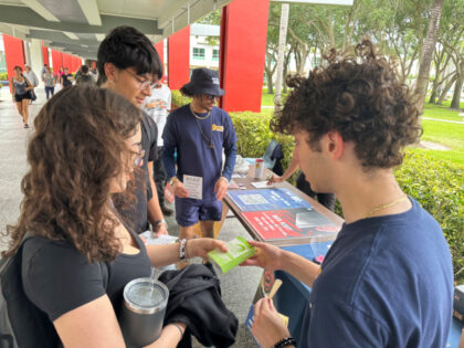 College students pass out Plan B to educate young voters at Florida Atlantic University on