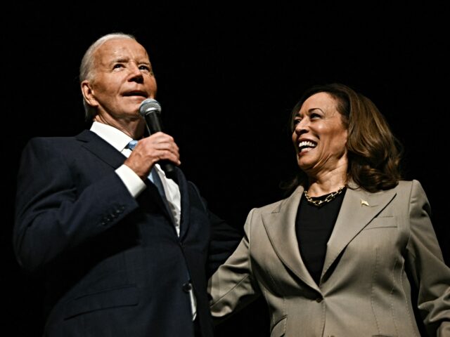 US Vice President and Democratic presidential candidate Kamala Harris looks on as Presiden