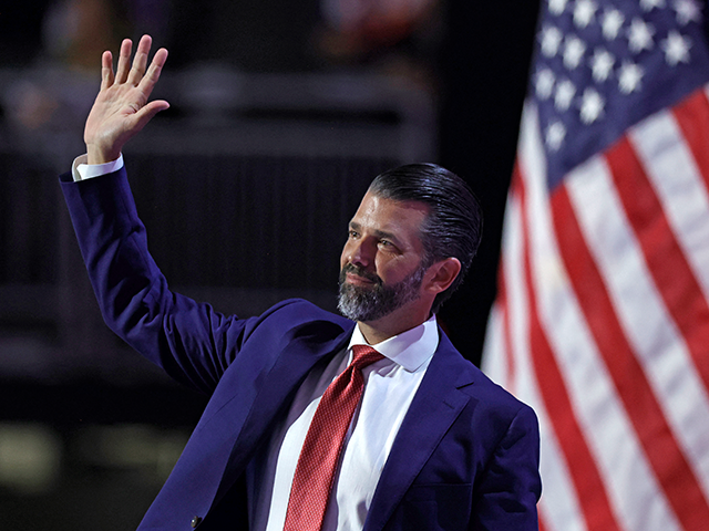 Son of former US President Donald Trump Donald Trump Jr. waves after speaking during the t