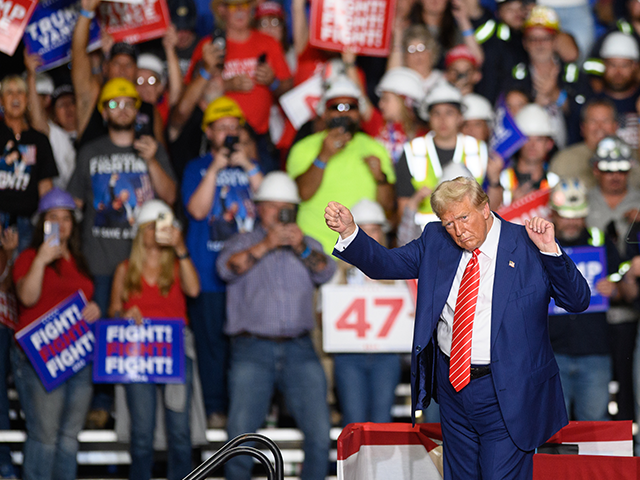 Former President Donald Trump dances on stage after a campaign rally on August 30, 2024, i