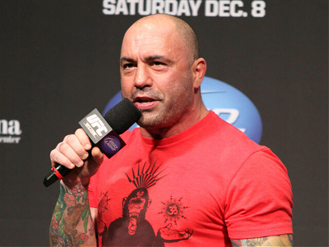 FILE - UFC announcer and podcaster Joe Rogan speaks at the weigh in before a UFC on FOX 5