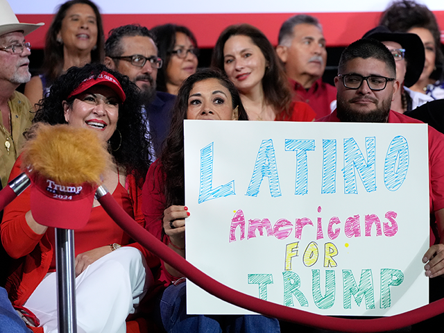 Supporters hold a sign before Republican presidential nominee former President Donald Trum