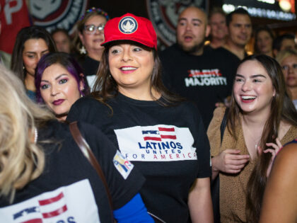 SAN ANTONIO, TX - MAY 14: Jen Salinas, Vice President of Latinos 4 Trump, takes photos wit